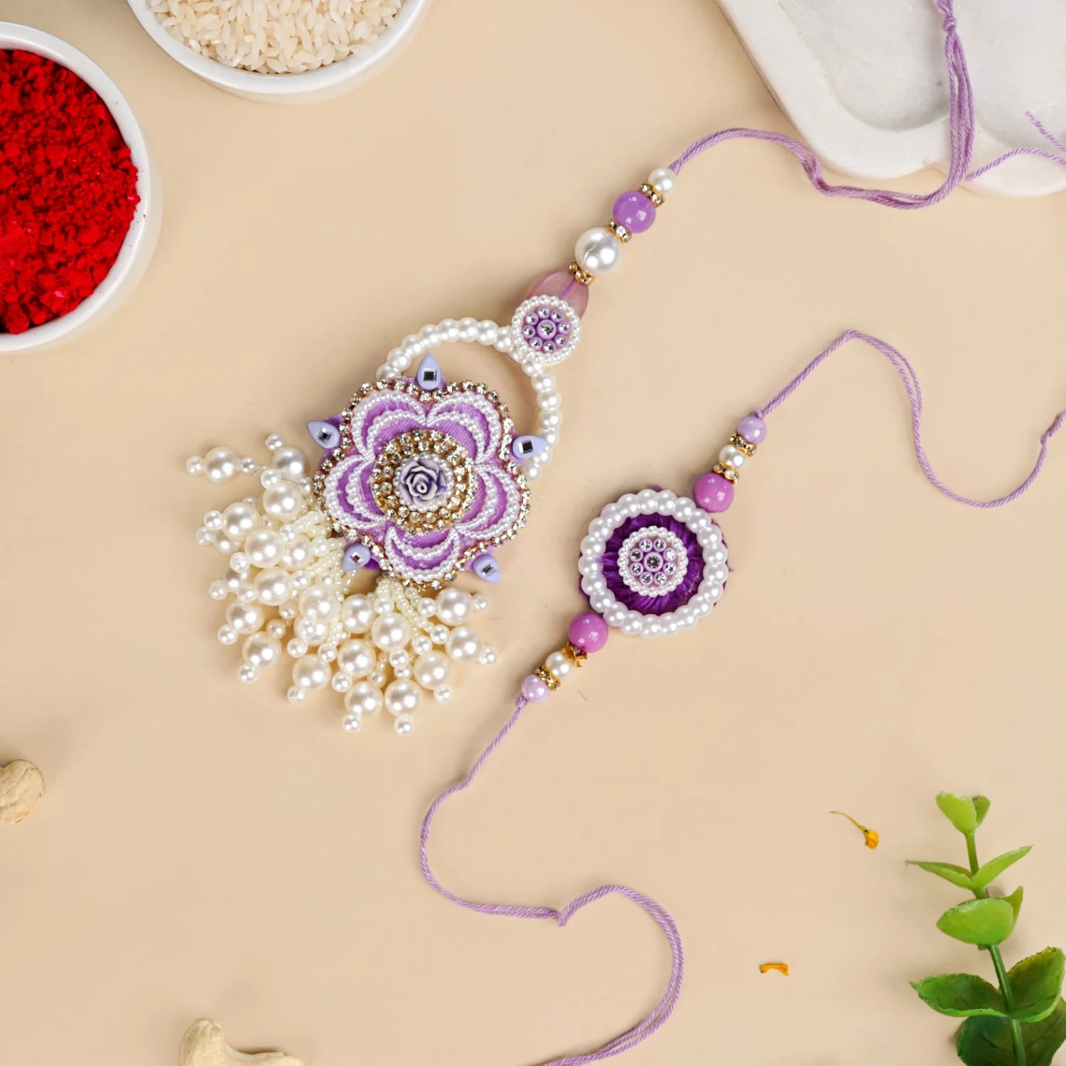 Purple Pearl Beaded Rakhi With Floral Lumba For Couples