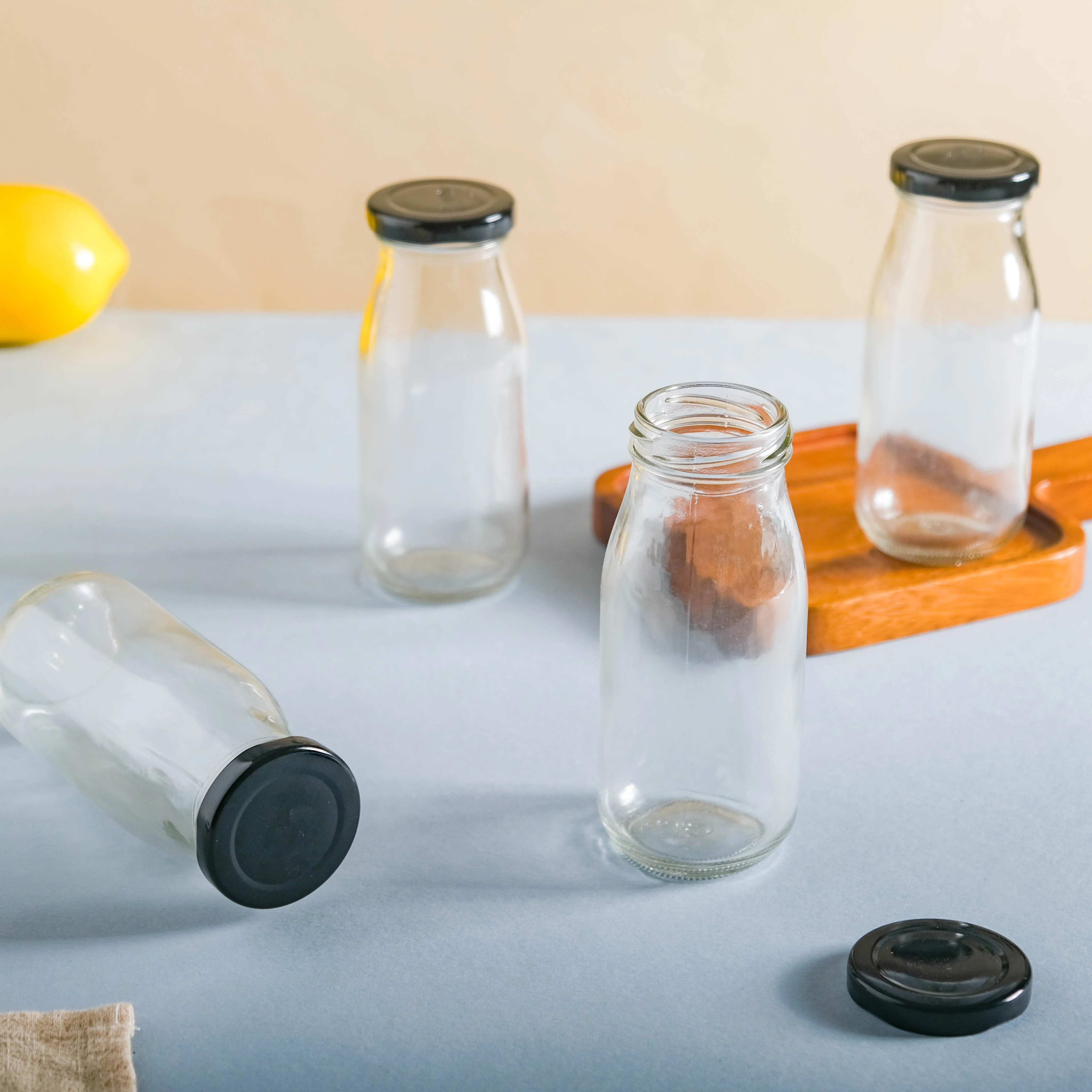 Small Glass Bottle with Lid Set of 4 - Image 3