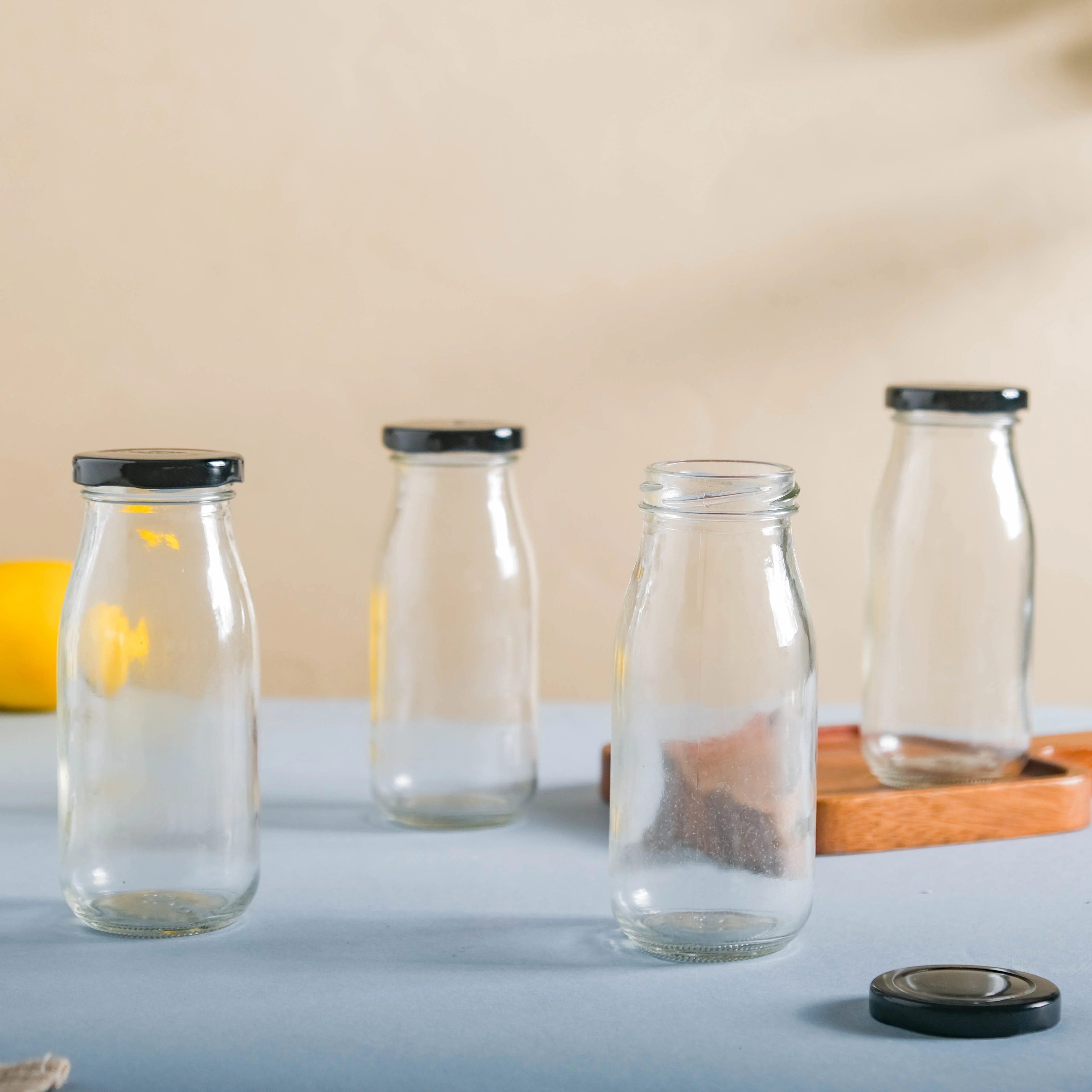 Small Glass Bottle with Lid Set of 4 - Image 4