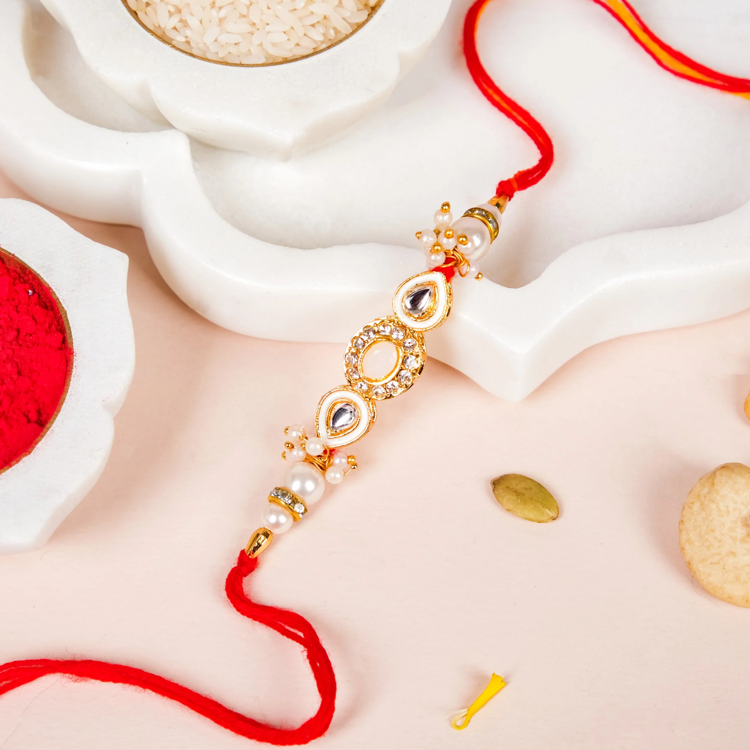 Stone And Pearl White Kundan Rakhi Set For Couple - Image 2